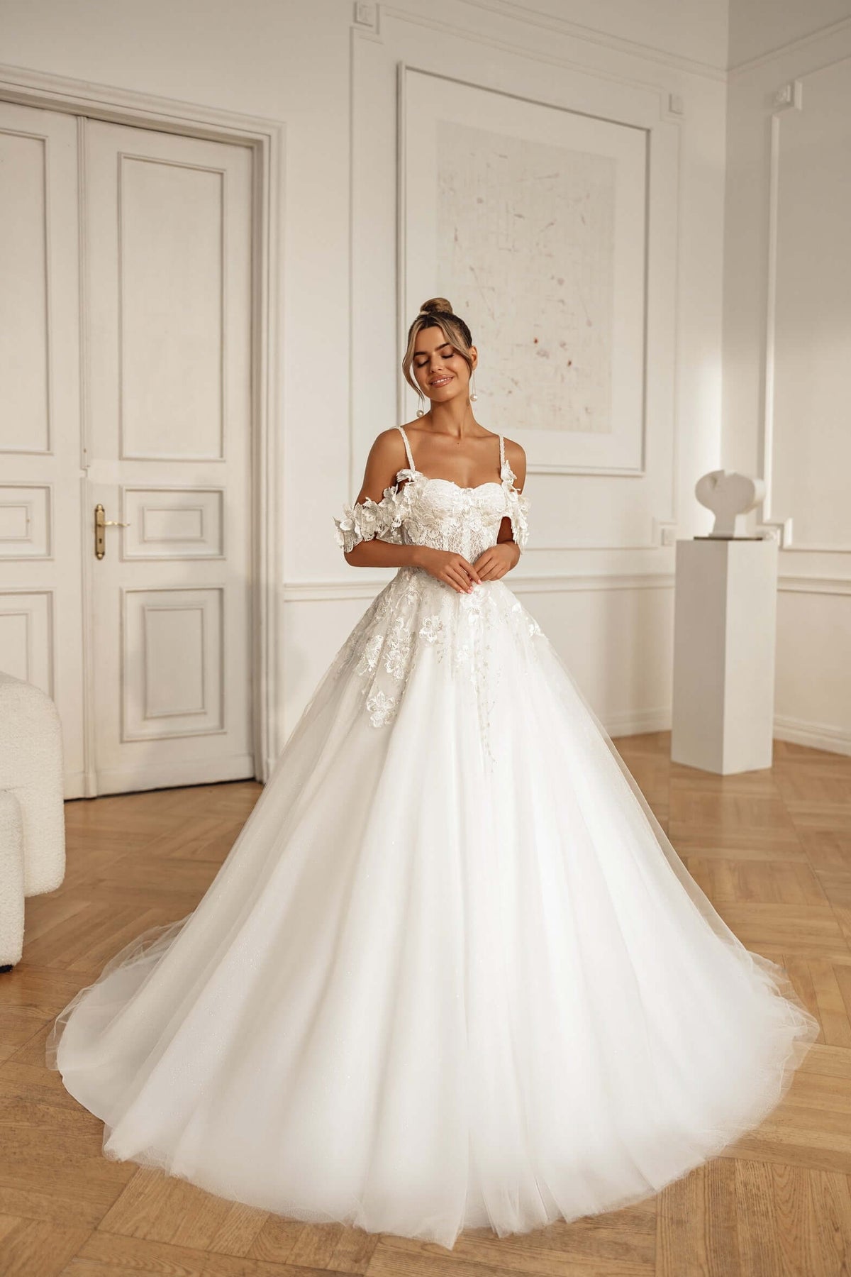 Sonya Aline wedding dress with off shoulder straps and 3D lace, showcasing a beautiful bridal look.