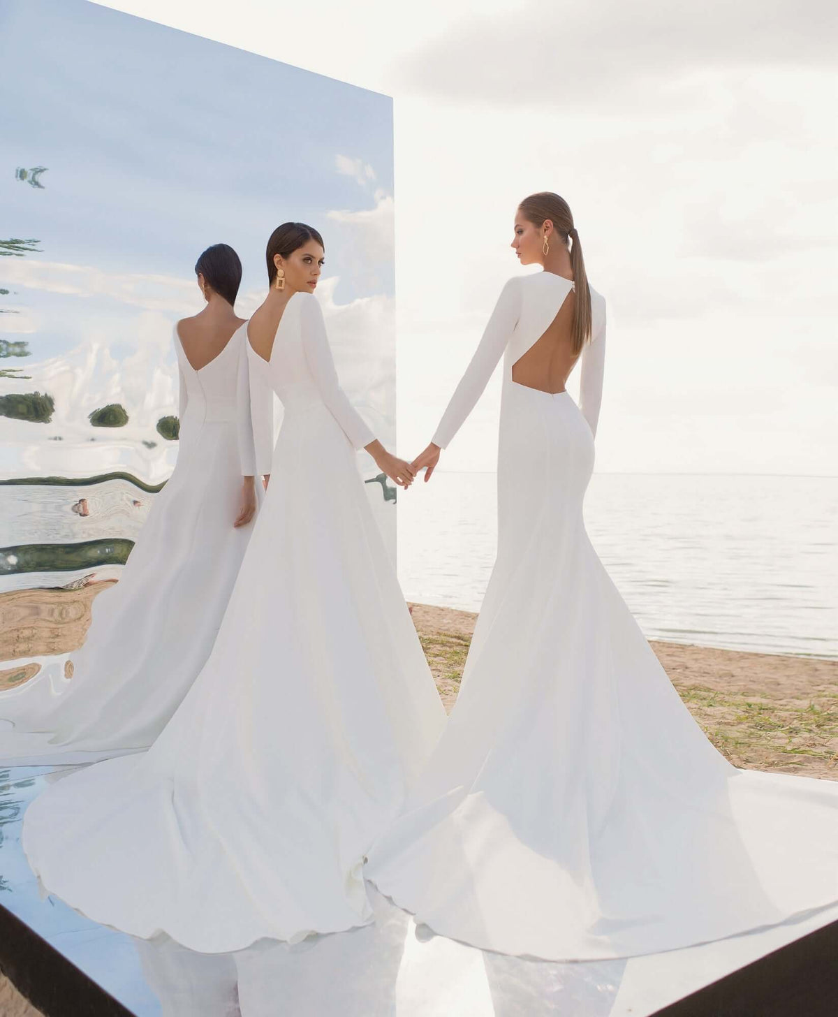 Stella - Crepe Fitted Wedding Dress - Size 6 worn by two models, showcasing the mermaid style and long sleeves.