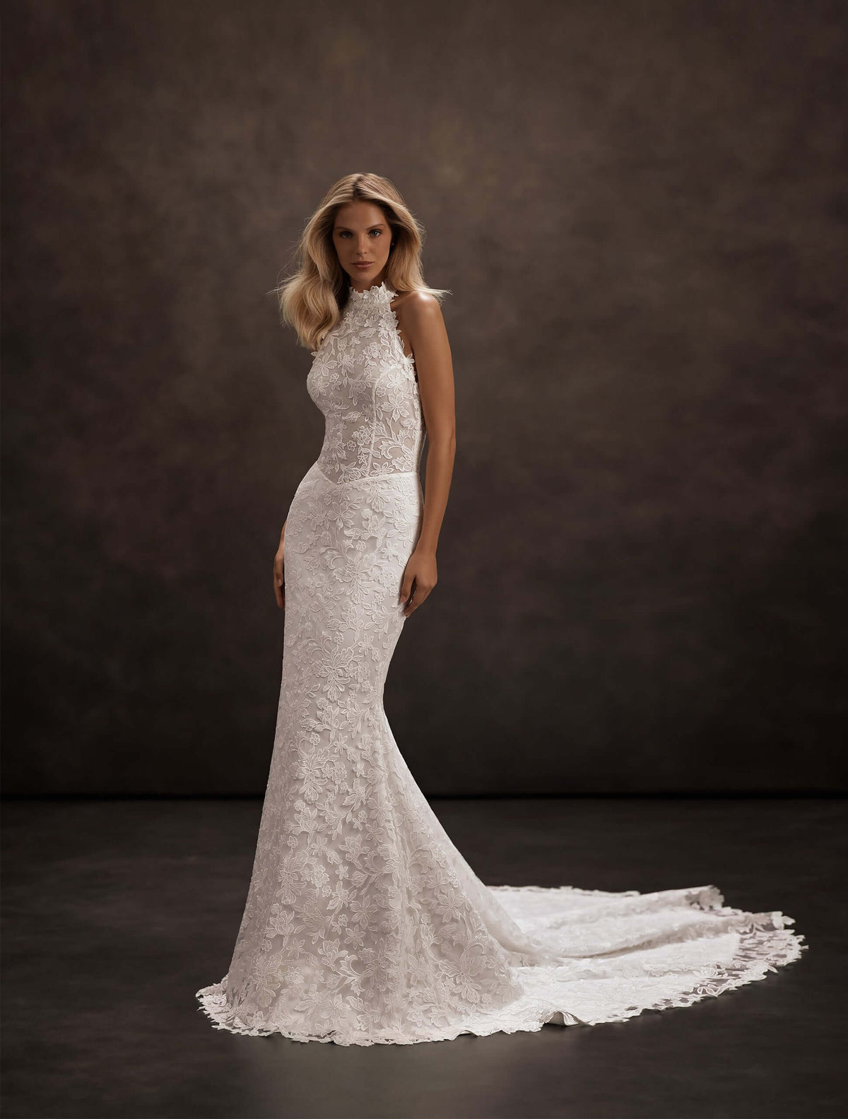 fit and flare lace wedding dress, halter neckline wedding dress, low back lace wedding dress, cathedral train wedding dress, basque waist wedding dress, corset bodice wedding dress, floral lace bridal gown, fitted lace mermaid wedding dress, modern romantic wedding dress, elegant lace bridal gown