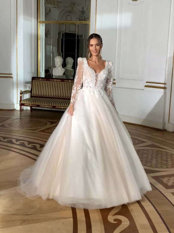 Corey - Aline Tulle Wedding Dress with long sleeves and beaded lace detail, showcasing a modern bridal look.