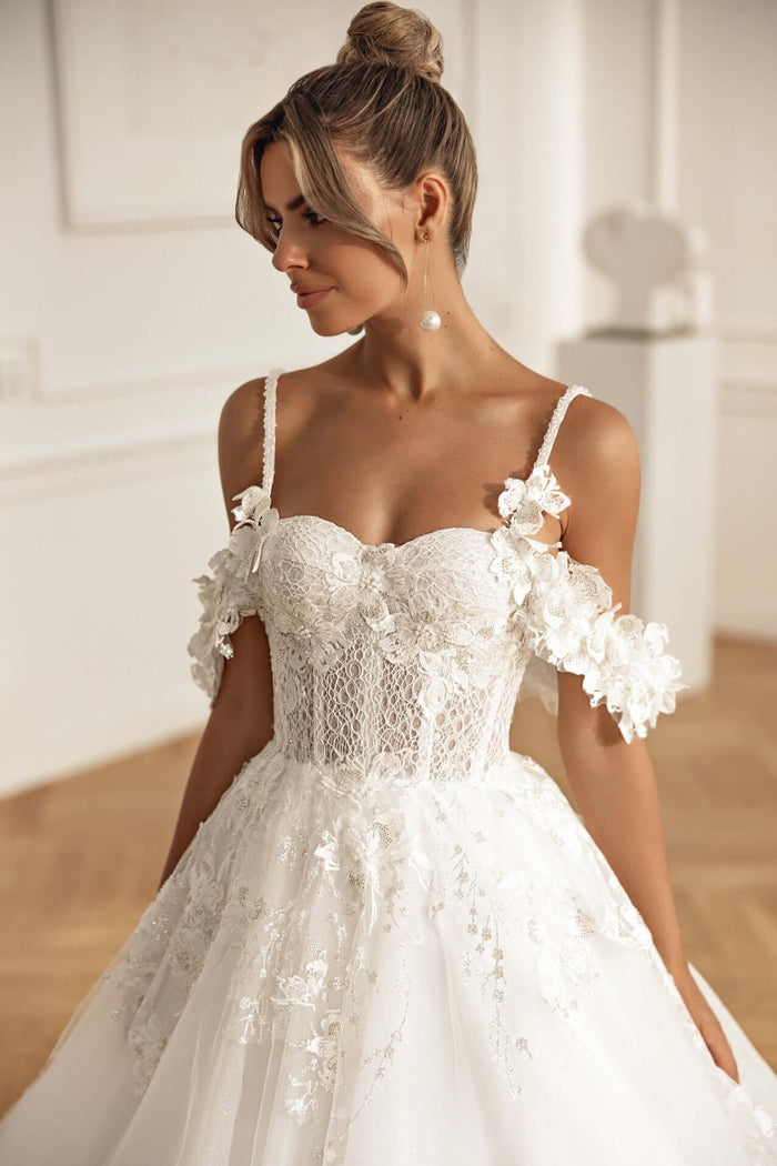 Aline wedding dress with off shoulder straps and 3D lace, showcasing a beautiful corset design.