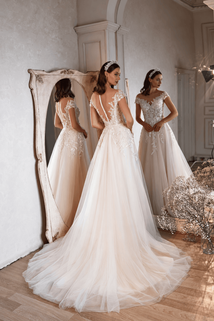 Aurora - Aline Wedding Dress - Size 8 showcased in a beautiful mirror reflection.