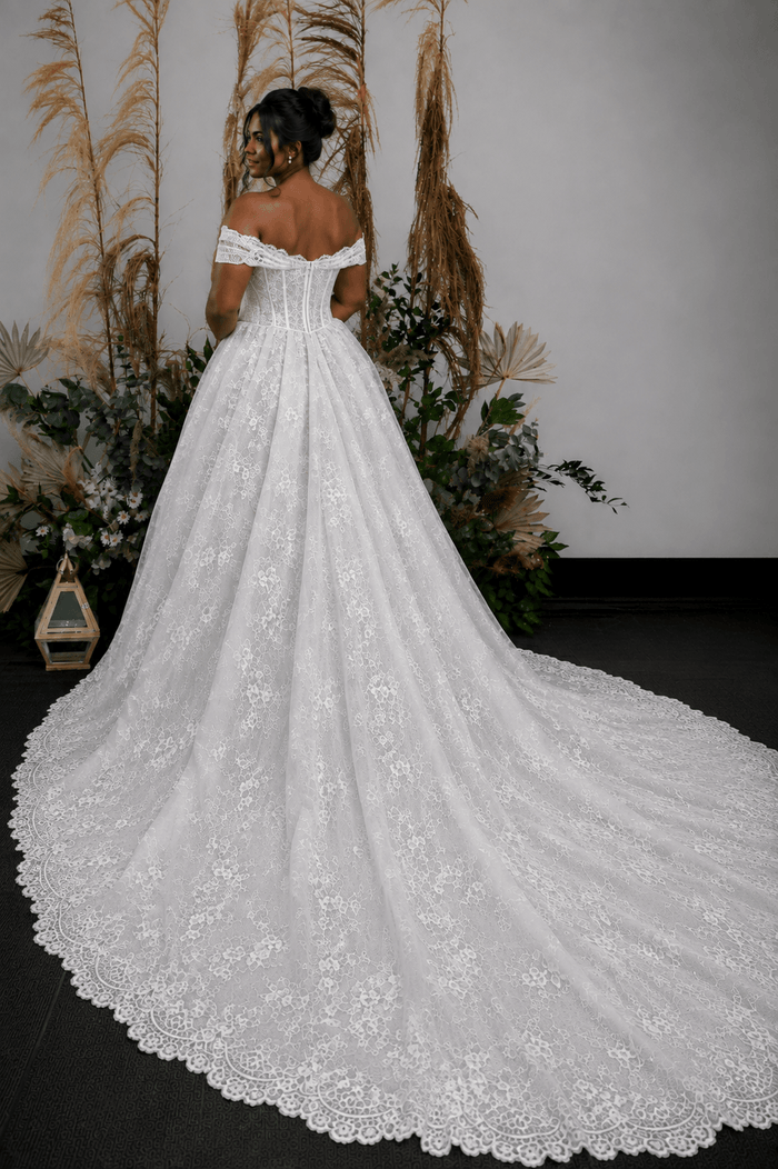 Chantilly lace, ball gown, draped cowl neck, off-shoulder straps, corset bodice, structured waist, floral lace, full skirt, scalloped hem, long train, plus size wedding dress