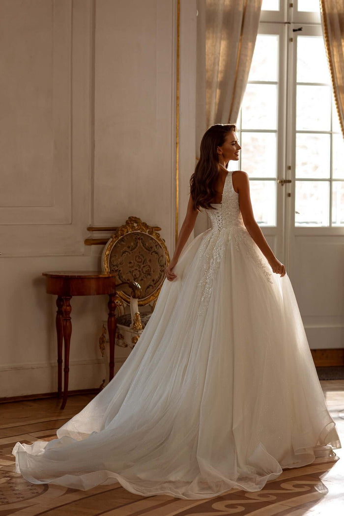 Aline tulle lace wedding dress with square neckline, showcasing the elegant back detail and flowing train.