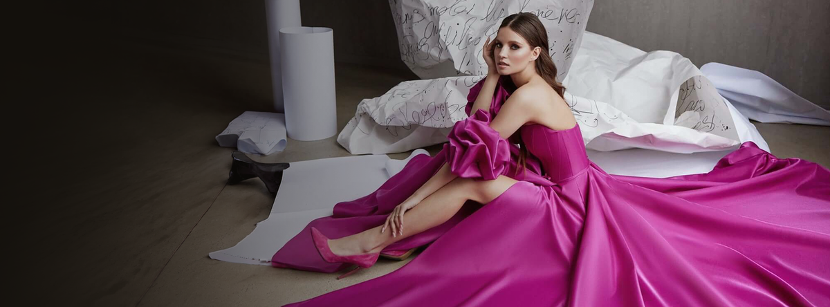 Woman wearing a fuchsia formal gown for prom, graduation or quinceañera