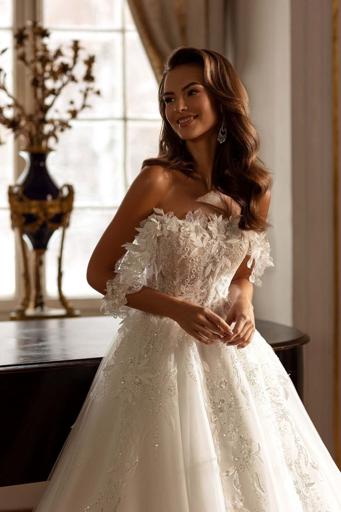 Becca Aline Tulle Lace Wedding Dress featuring off the shoulder straps and 3D lace details.