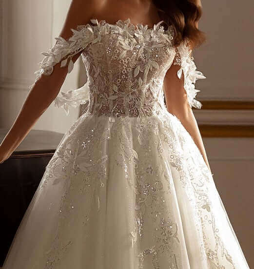 Elegant off the shoulder Aline tulle lace wedding dress with 3D lace details and built-in corset.