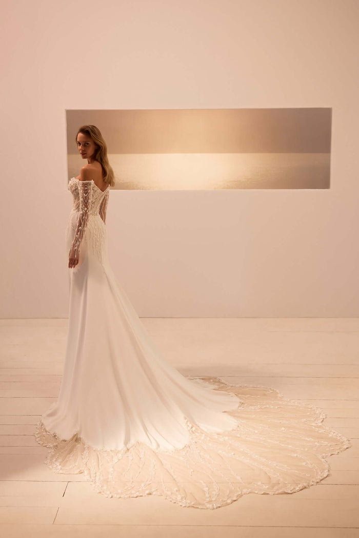 ivory wedding dress, wedding dress with sleeves, fit and flare, lace wedding dress, bridal shop Canada, mermaid dress wedding,