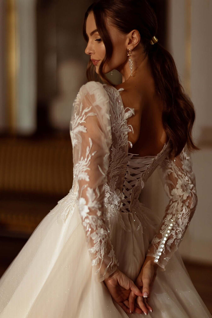 Corey - Aline Tulle Wedding Dress showcasing fitted long sleeves and beaded lace detail on the back.