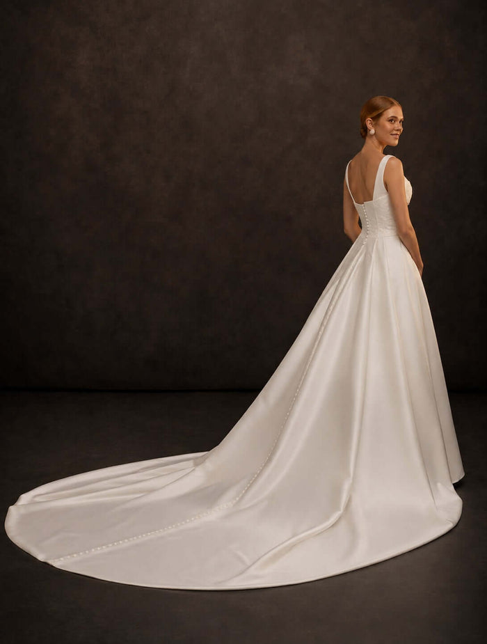 satin wedding dress, basque waist, long train, square neckline, structured corset bodice, minimalist bridal gown, A-line silhouette, elegant bridal fashion, modern wedding dress, timeless bridal elegance