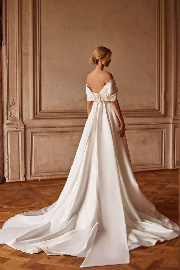 plain Aline wedding gown with low back and long train with rose accents