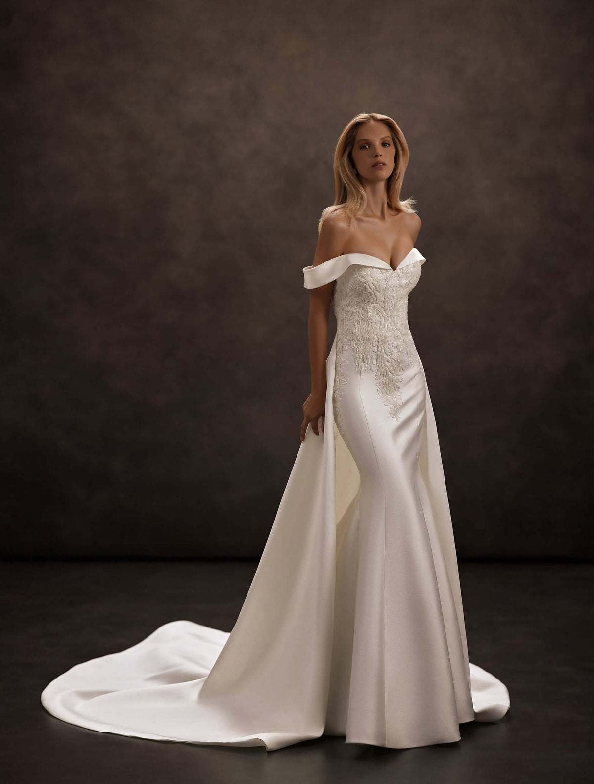 satin wedding dress, removable overskirt train, detachable train, off-the-shoulder neckline, sweetheart corset bodice, fitted mermaid silhouette, lace appliqué bodice, bridal gown with train, elegant minimalist wedding dress, modern bridal fashion