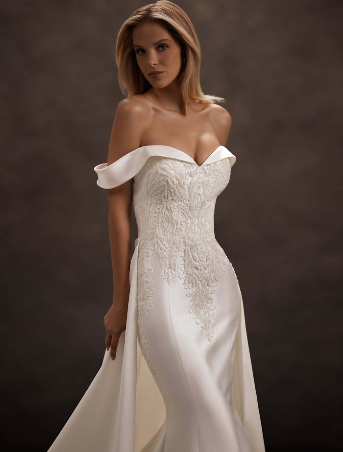 satin wedding dress, removable overskirt train, detachable train, off-the-shoulder neckline, sweetheart corset bodice, fitted mermaid silhouette, lace appliqué bodice, bridal gown with train, elegant minimalist wedding dress, modern bridal fashion