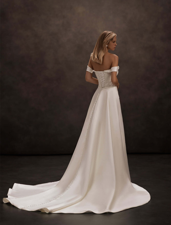 satin wedding dress, removable overskirt train, detachable train, off-the-shoulder neckline, sweetheart corset bodice, fitted mermaid silhouette, lace appliqué bodice, bridal gown with train, elegant minimalist wedding dress, modern bridal fashion