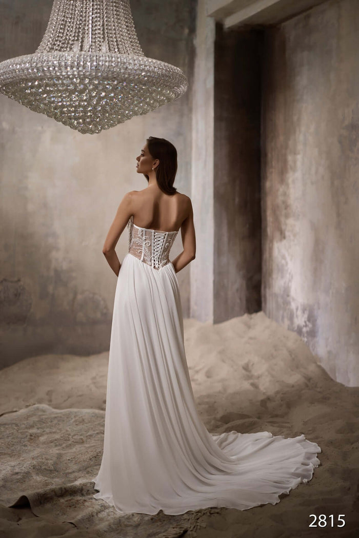 strapless wedding dress with lace up bodice and long train