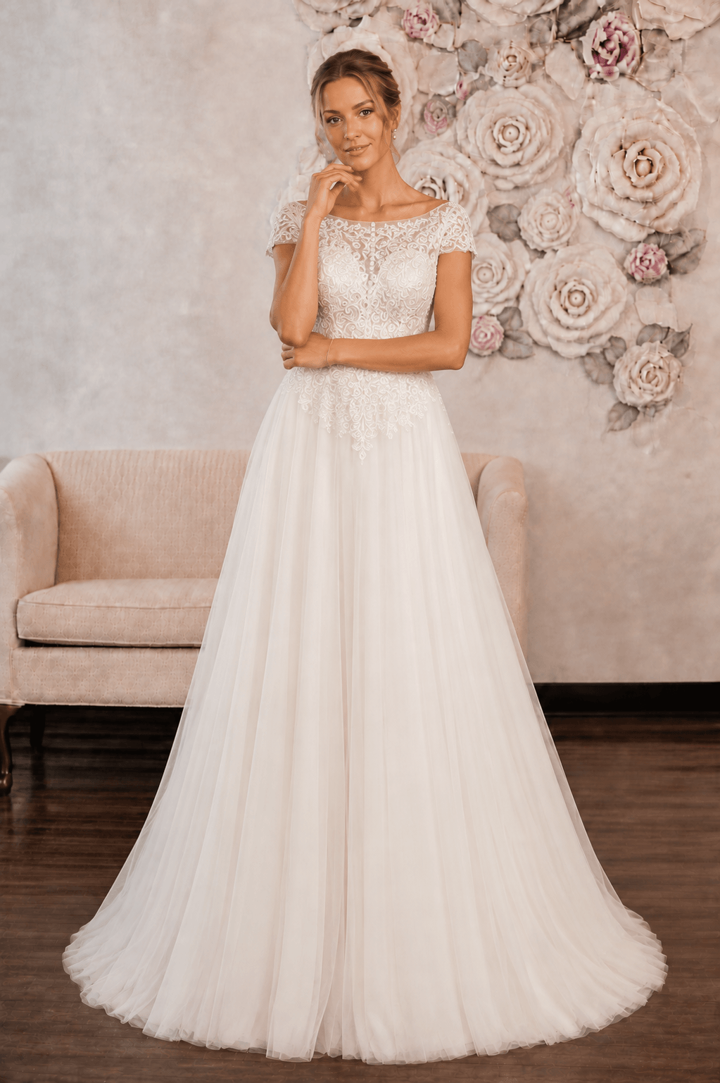 Melody - Aline Tulle Lace Wedding Dress - Size 12 on model showcasing cup sleeves and off-white tulle design.