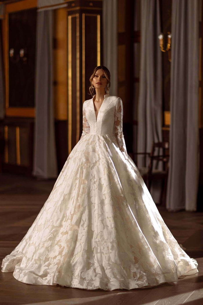 Aline Wedding Dress with long sleeves and V neckline, made from modern floral lace fabric.
