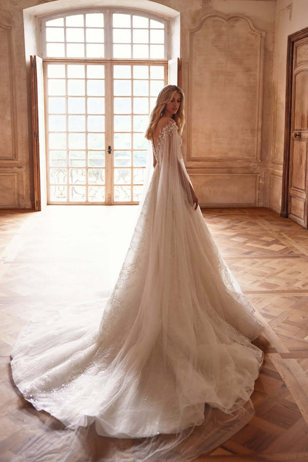 princess silhouette gown

ball gown wedding dress

flowing train bridal dress

elegant bridal ball gown

romantic princess dress

