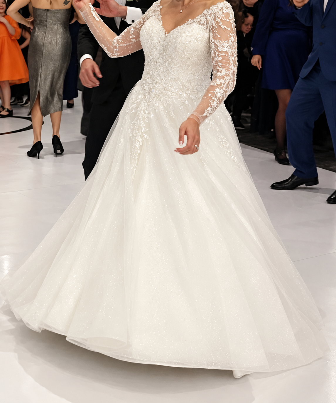 Bride wearing a custom wedding dress and matching veil from Poshfair