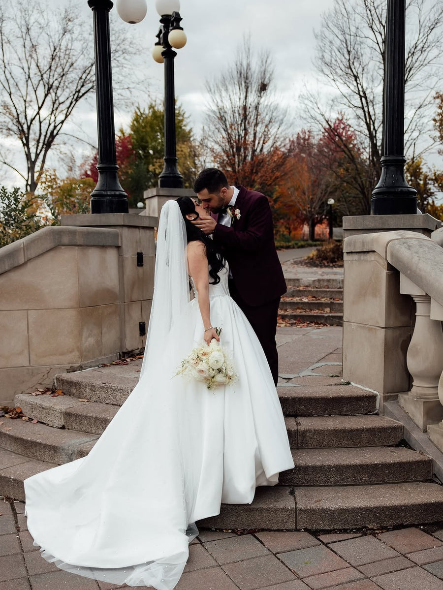 Ottawa bride wearing a Poshfair wedding gown with her groom
