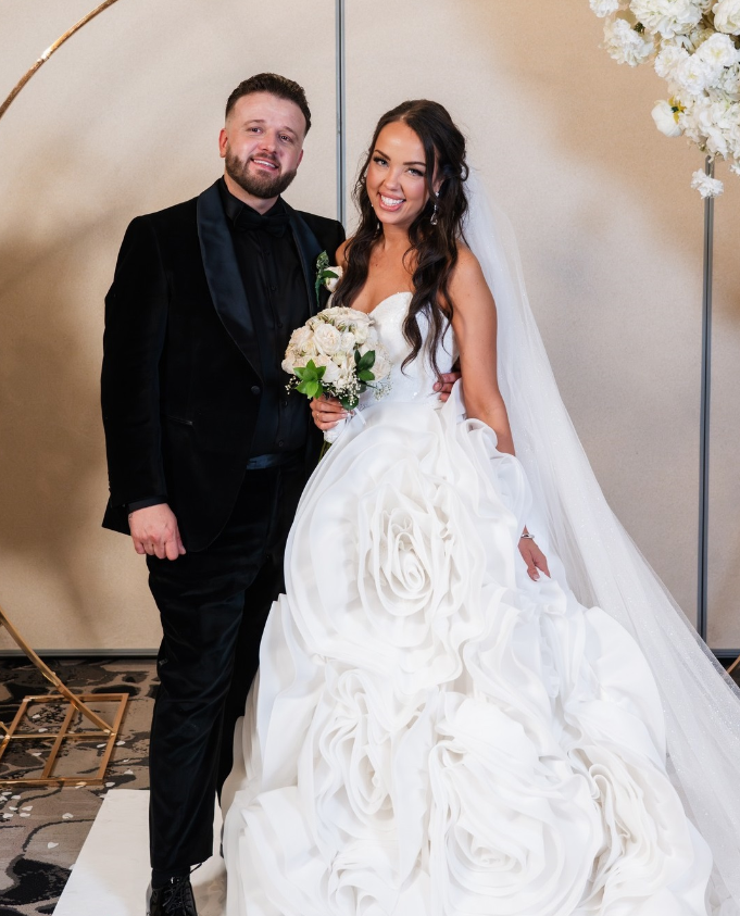Real bride and groom with the bride wearing a custom floral wedding gown in Ottawa