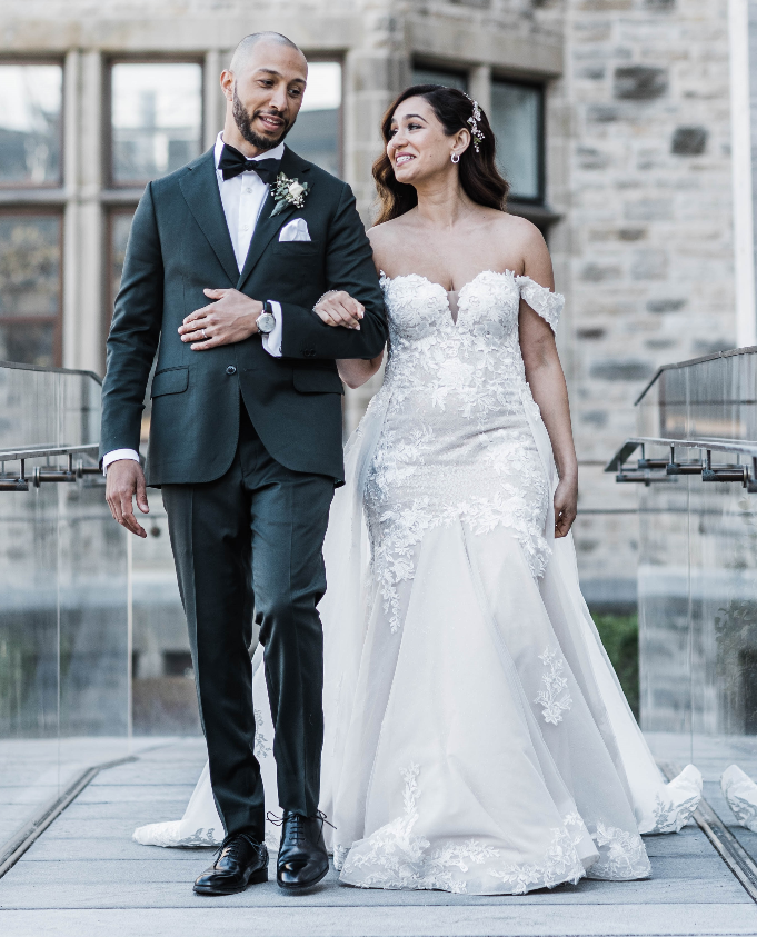 Bride and groom with the bride wearing a custom lace wedding gown in Ottawa