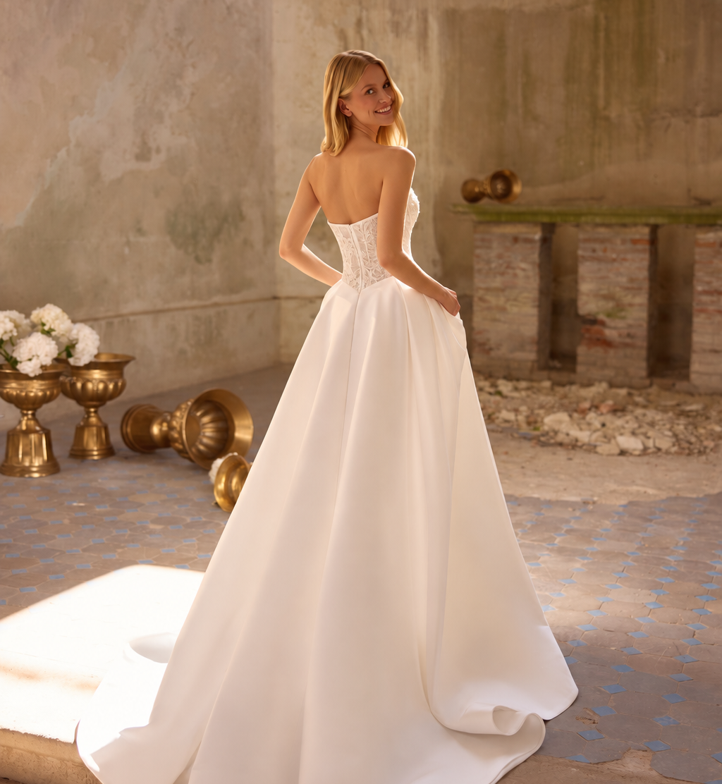 Bride wearing a strapless white wedding gown at Poshfair Bridal Boutique in Ottawa