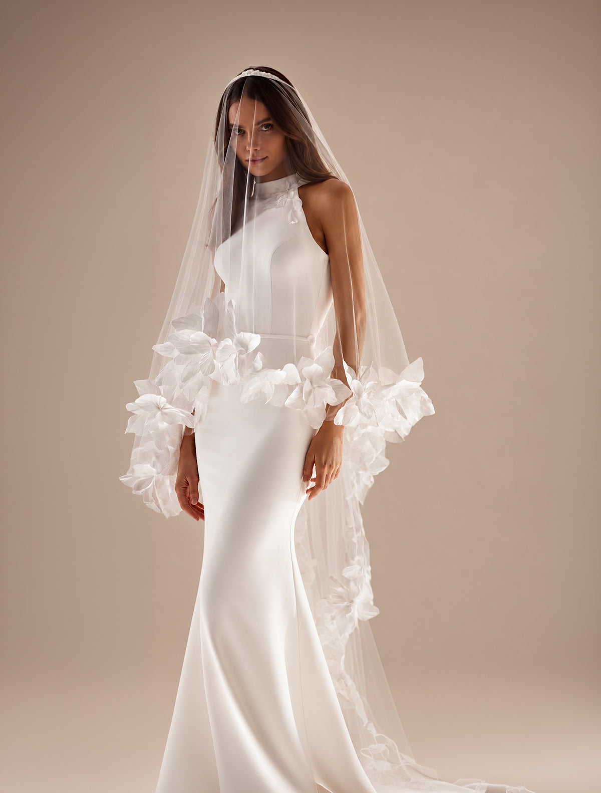 Bride wearing a modern wedding veil and bridal gown