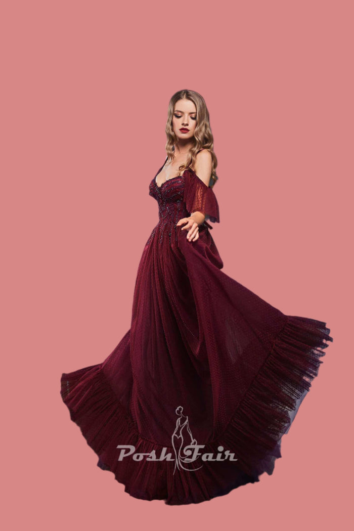 Elegant model wearing a 406 - Aline sweetheart neckline tulle evening dress in burgundy with flowing skirt.