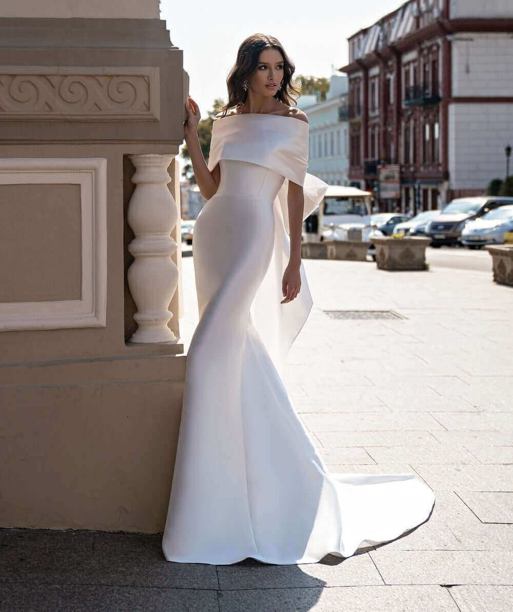 wedding dress with bow, satin wedding dress, satin bridal gown, form fitting wedding dress with train, bridal boutique in orleans, fit and flare wedding dress