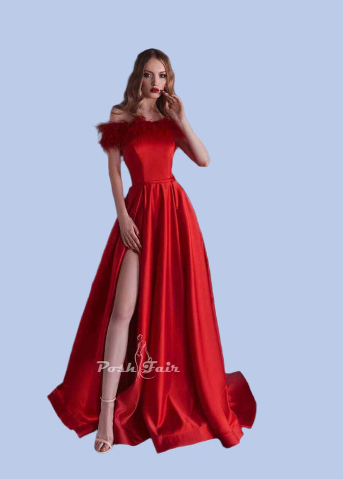 Woman wearing a stunning red satin evening dress with straight neckline, feather decor, and a stylish slit.